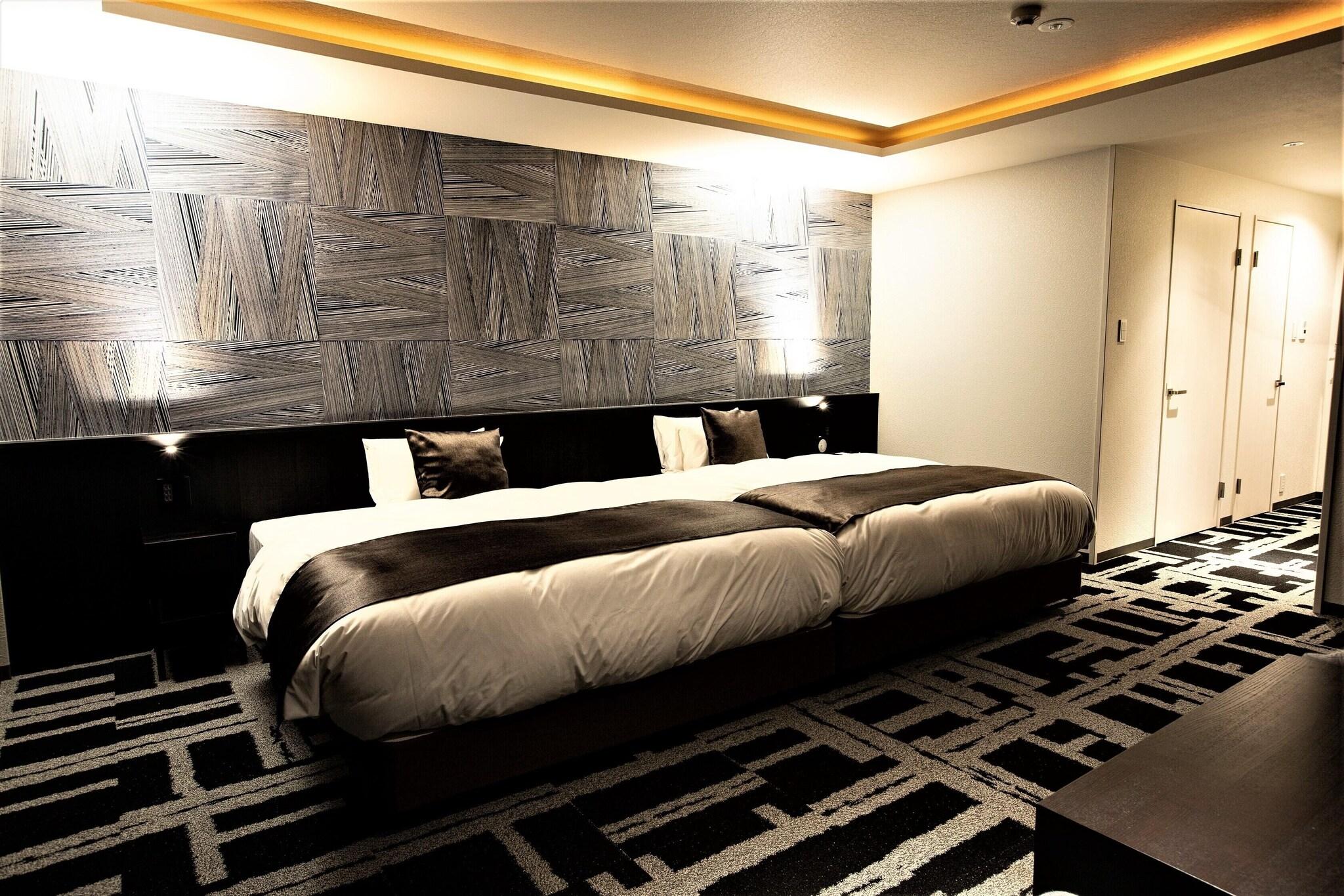 Quadruple Deluxe Two Queen Beds