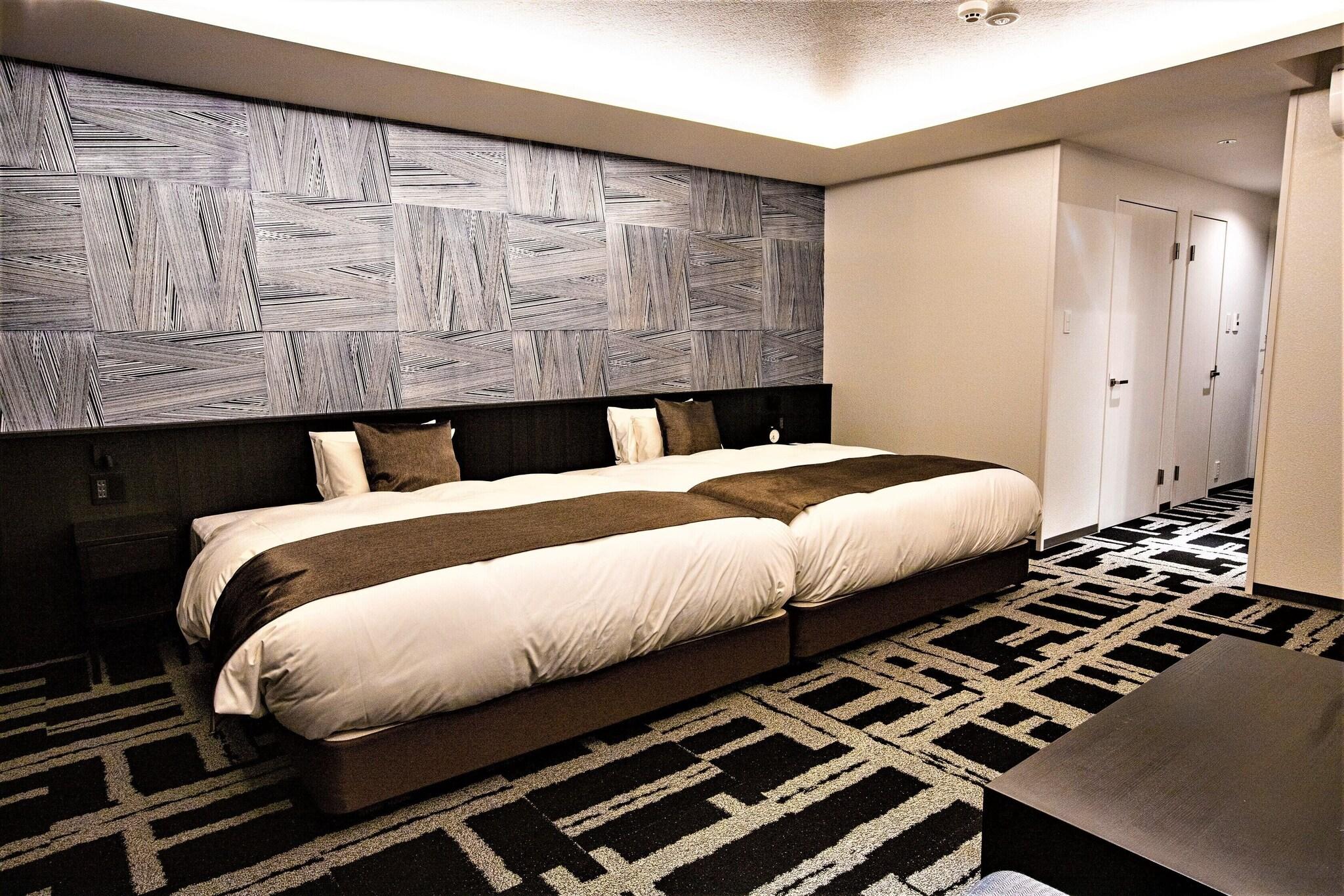 Quadruple Deluxe Two Queen Beds