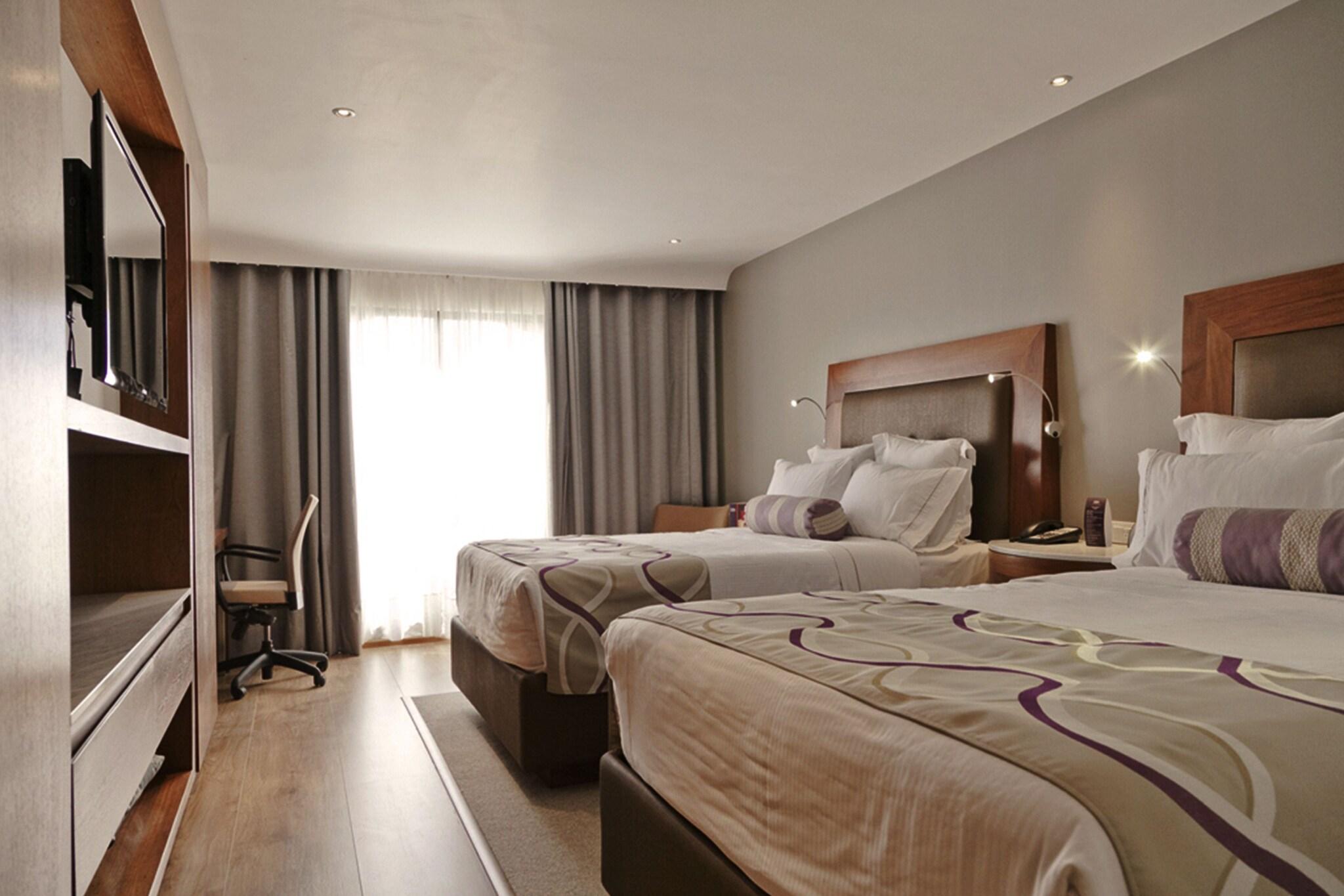 Double Deluxe Two Queen Beds