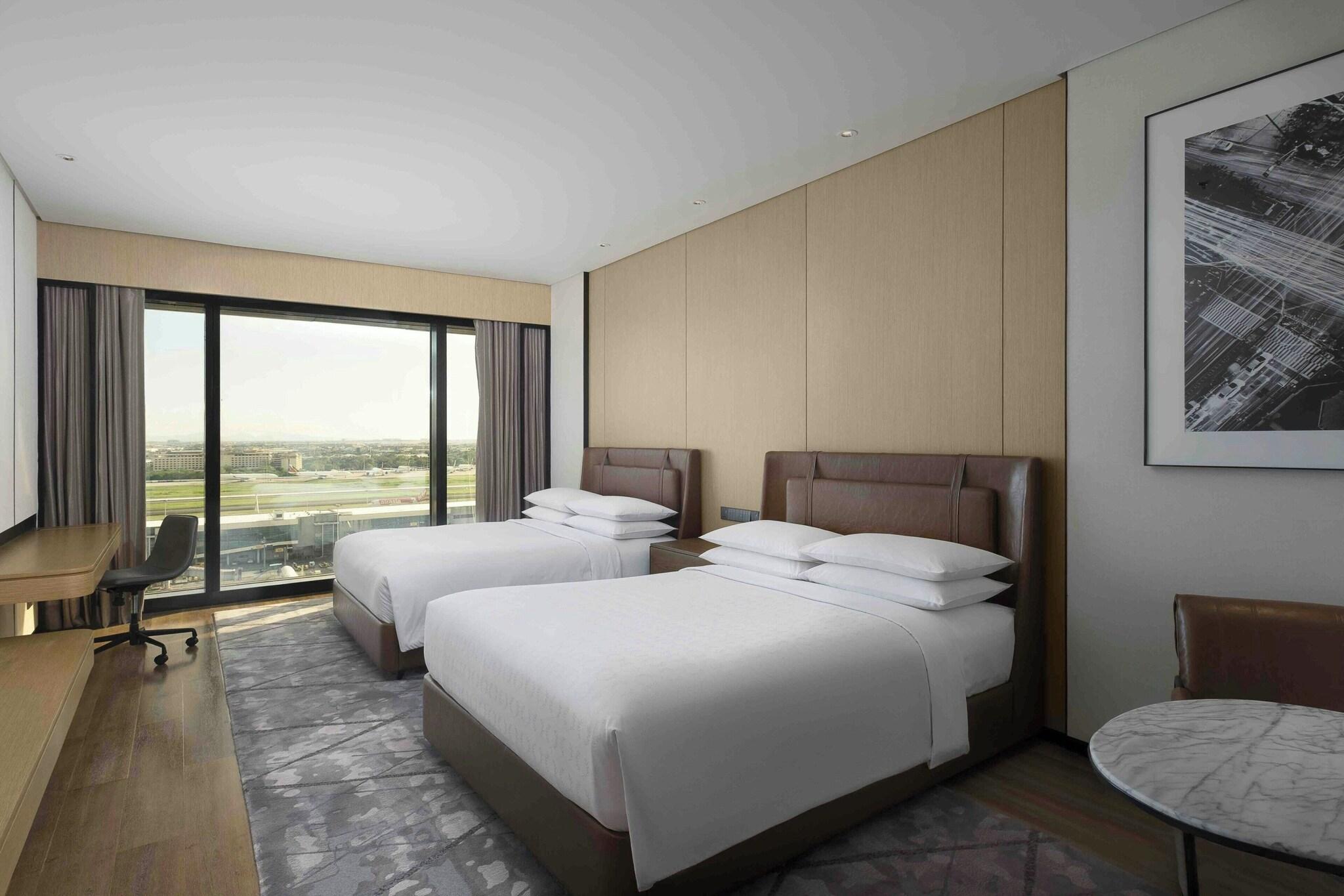 Quadruple Club Two Queen Beds