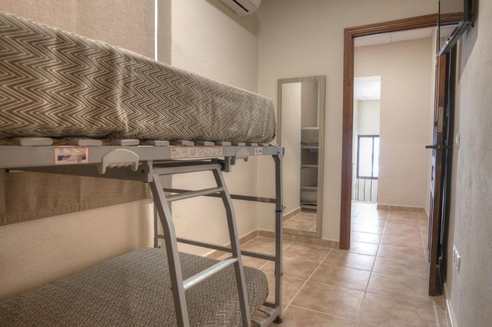 Triple Bunk Bed with Shared Bathroom