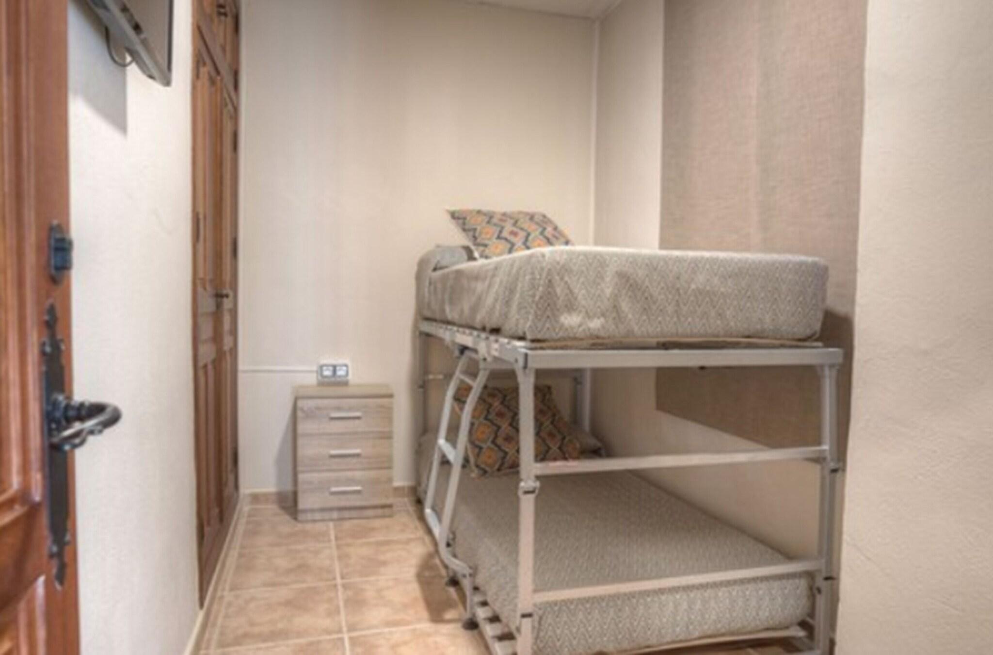 Triple Bunk Bed with Shared Bathroom
