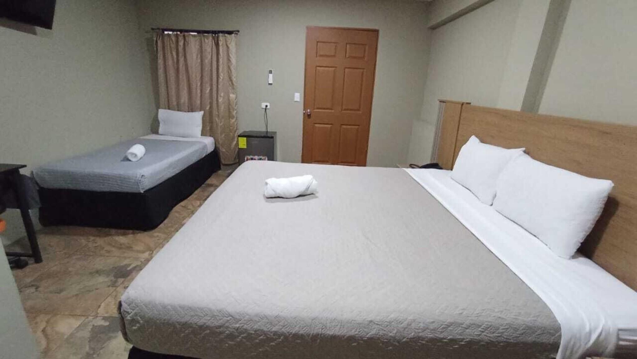 Quadruple Deluxe Two Queen Beds