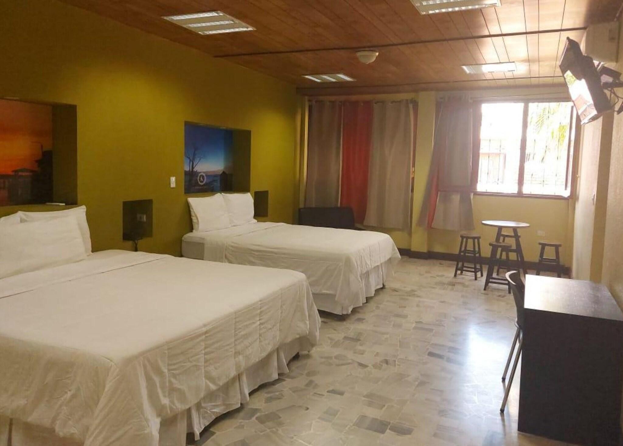 Quadruple Deluxe Two Queen Beds