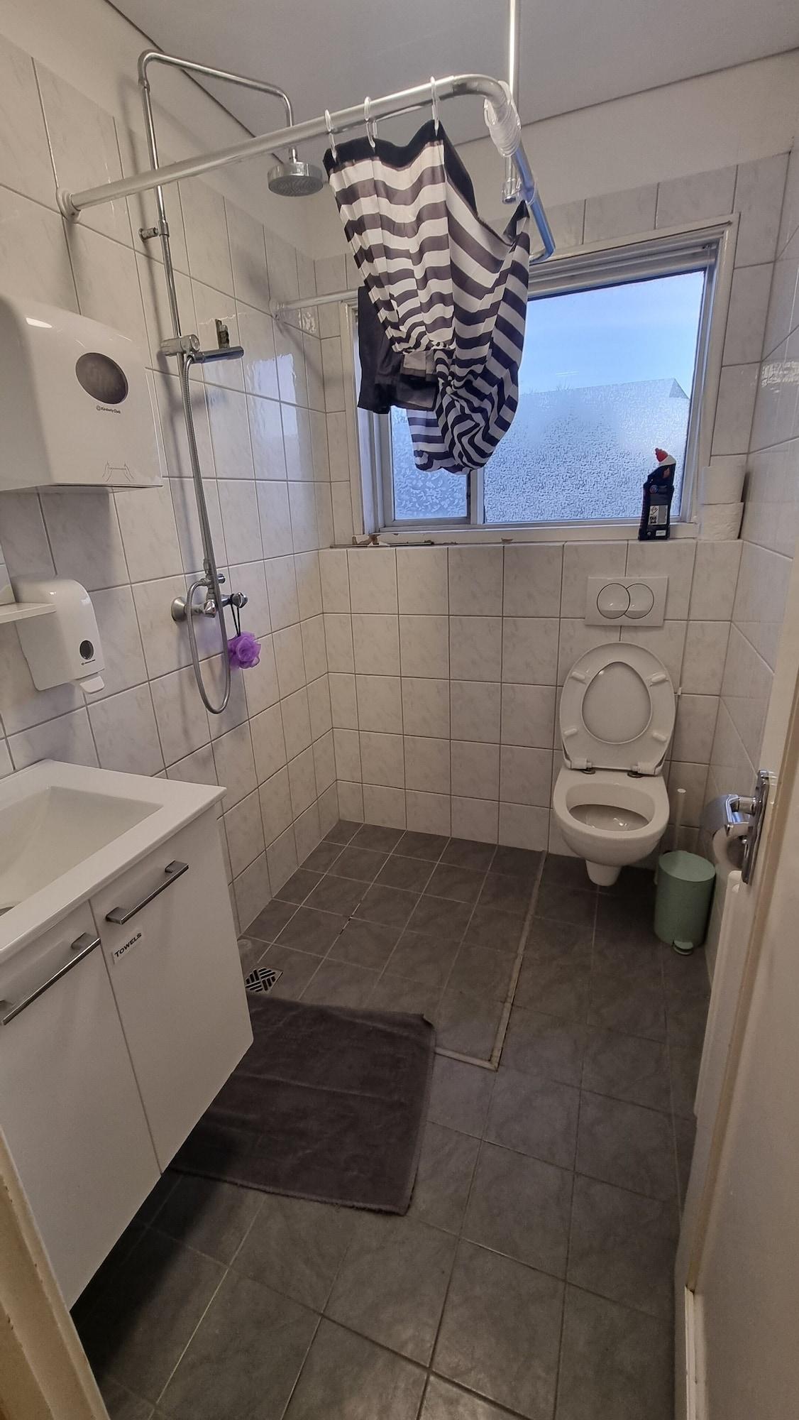 Single Economy with Shared Bathroom