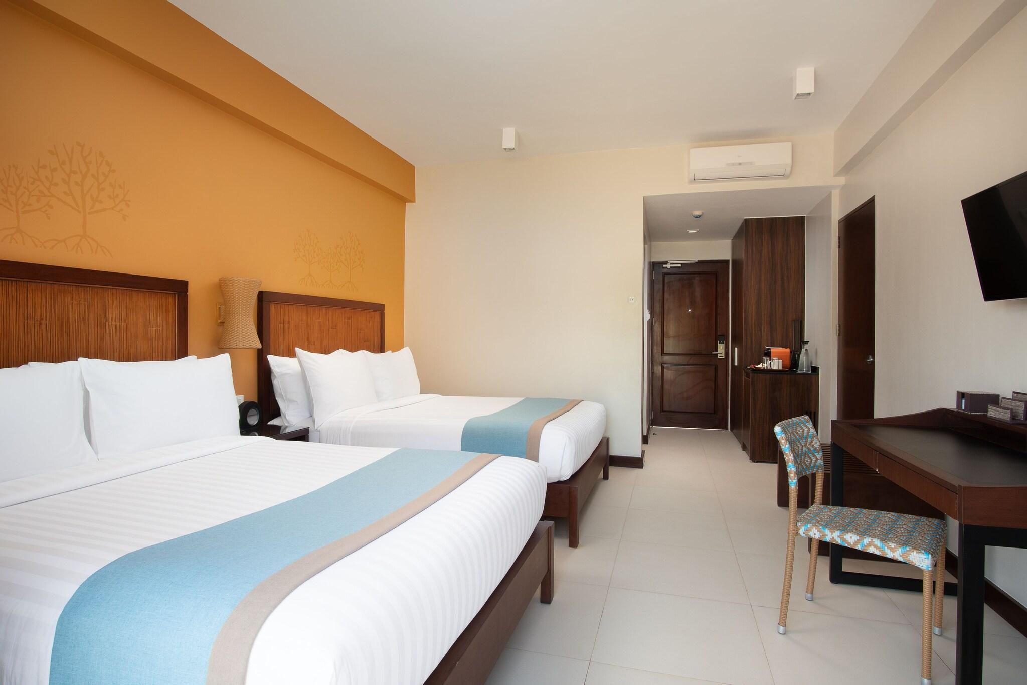 Quadruple Deluxe Two Queen Beds