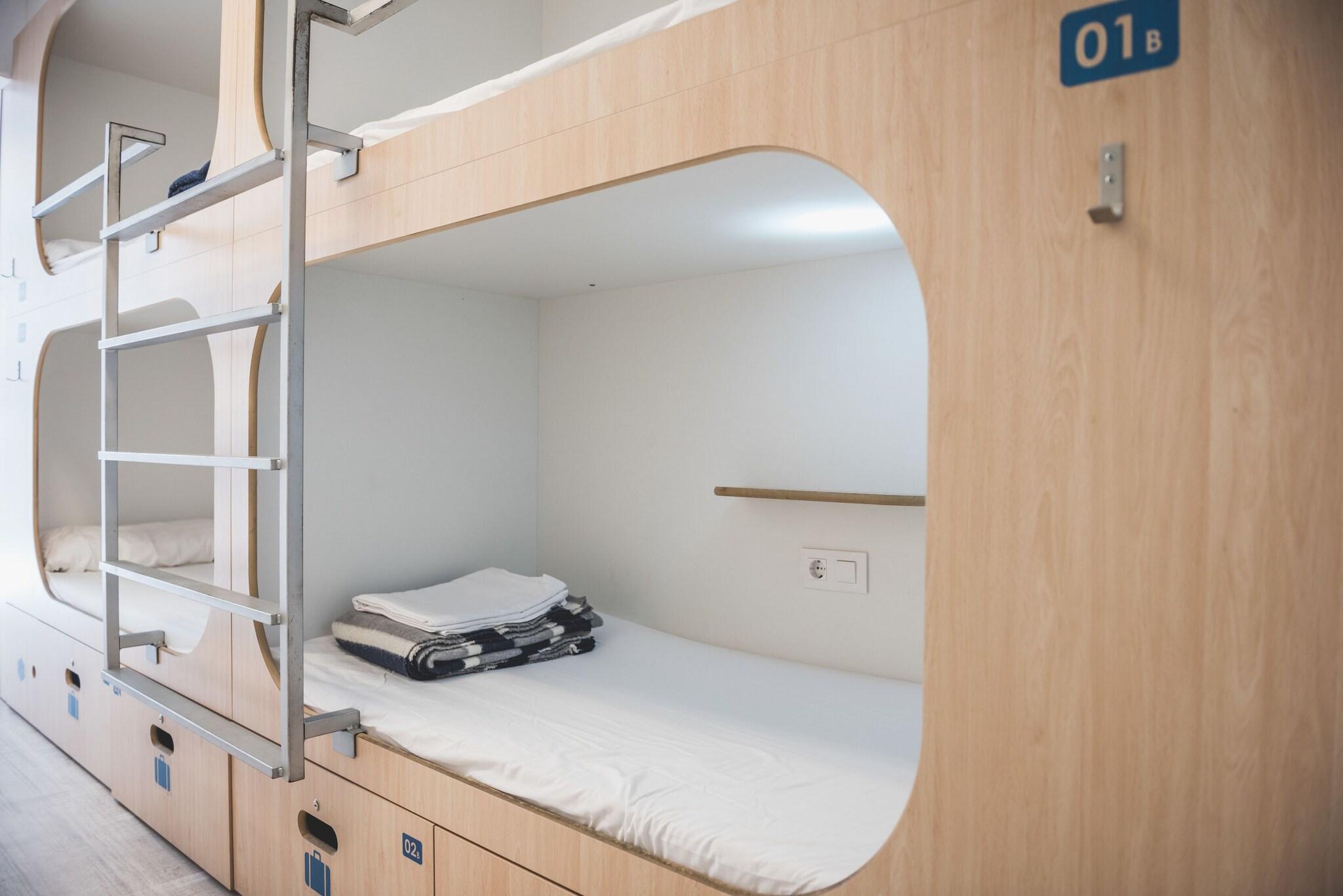 Bed in Dormitory with Shared Bathroom