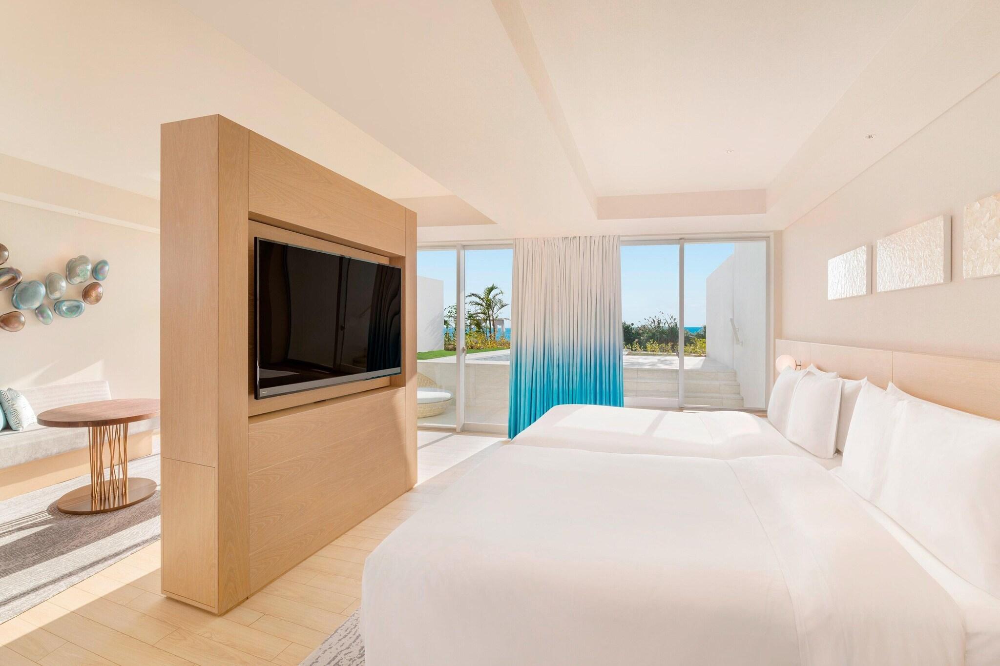 Junior Suite Partial Ocean View Two Double Beds