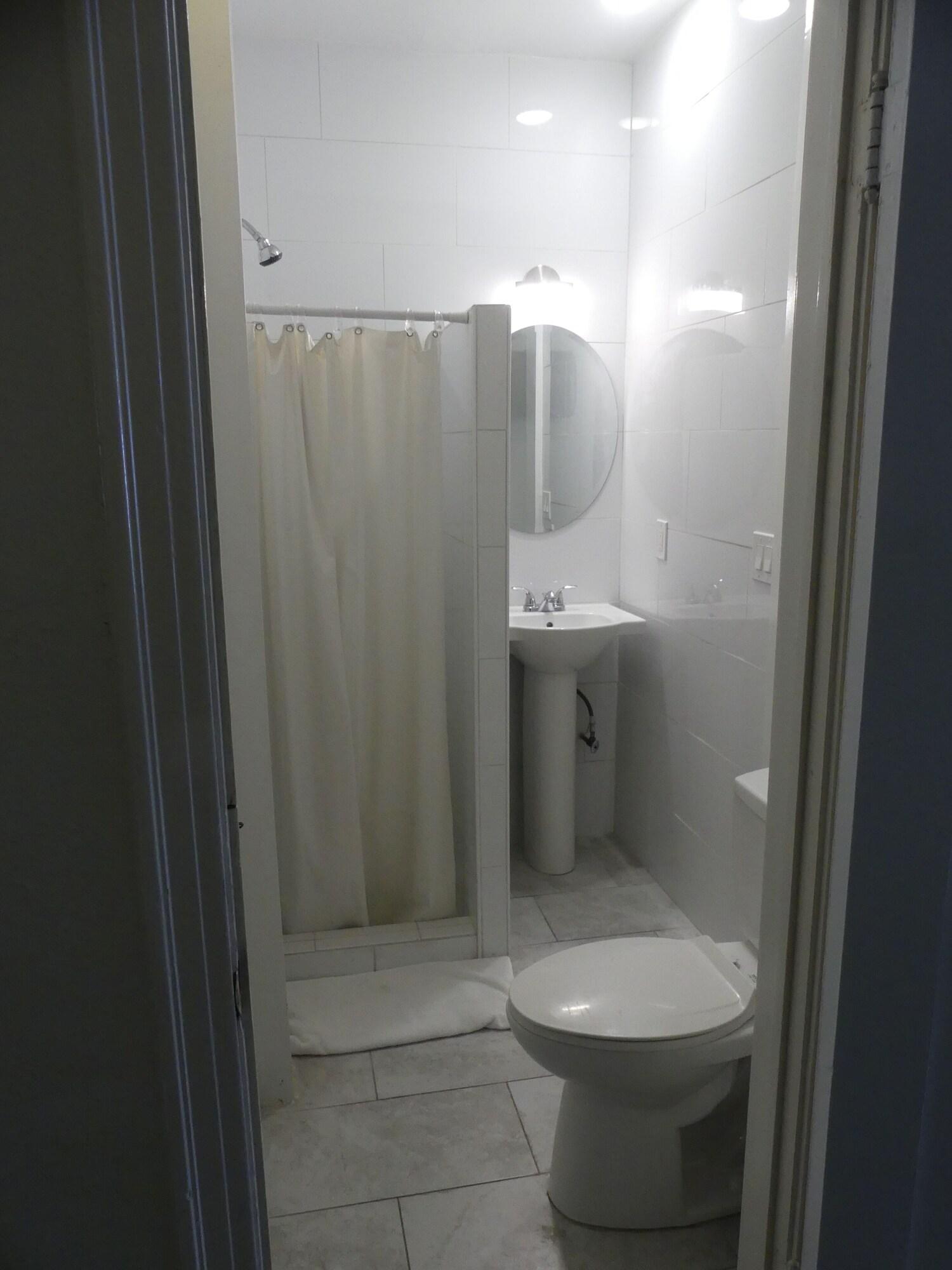 Bed in Dormitory with Shared Bathroom