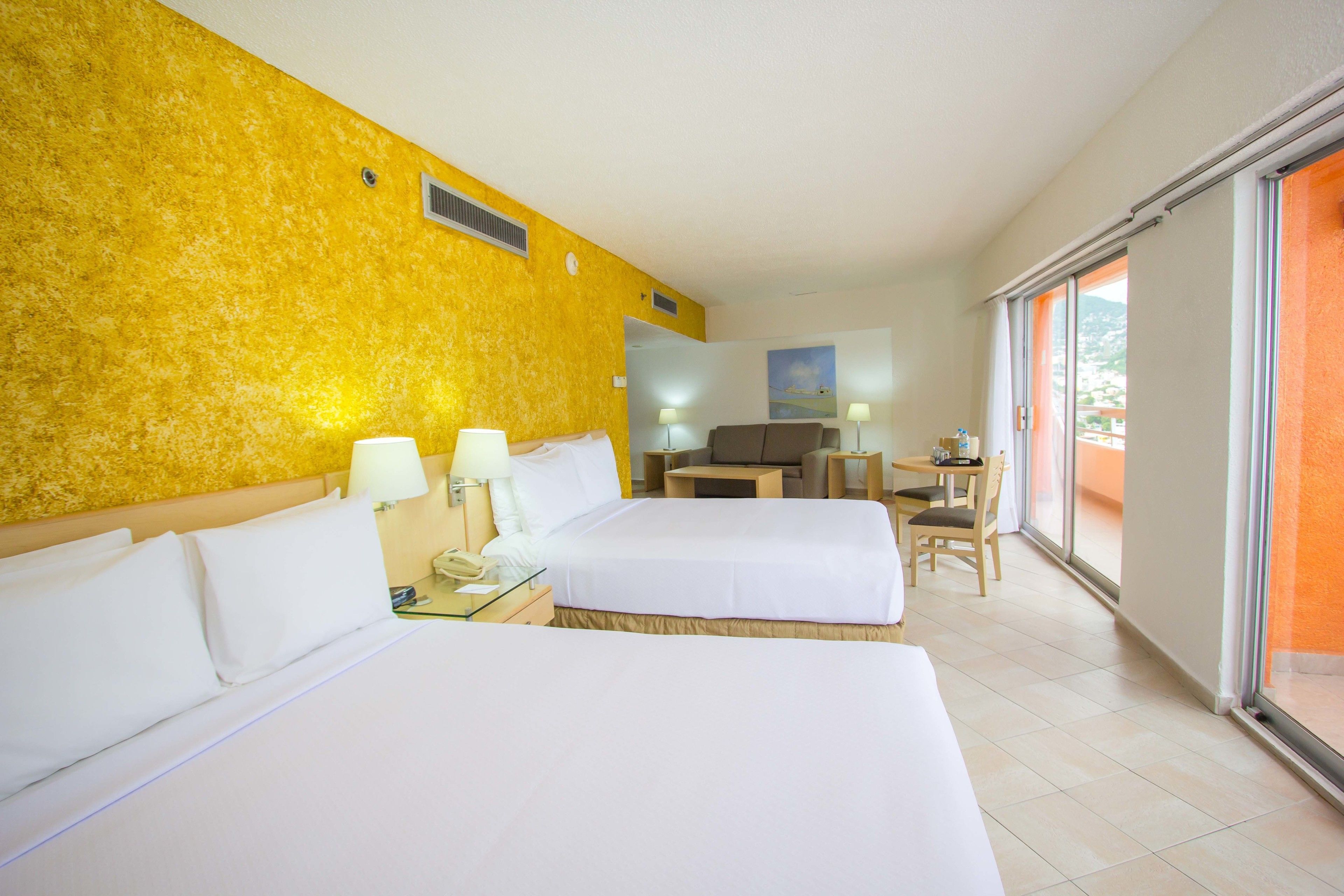 Junior Suite Partial Ocean View Two Double Beds