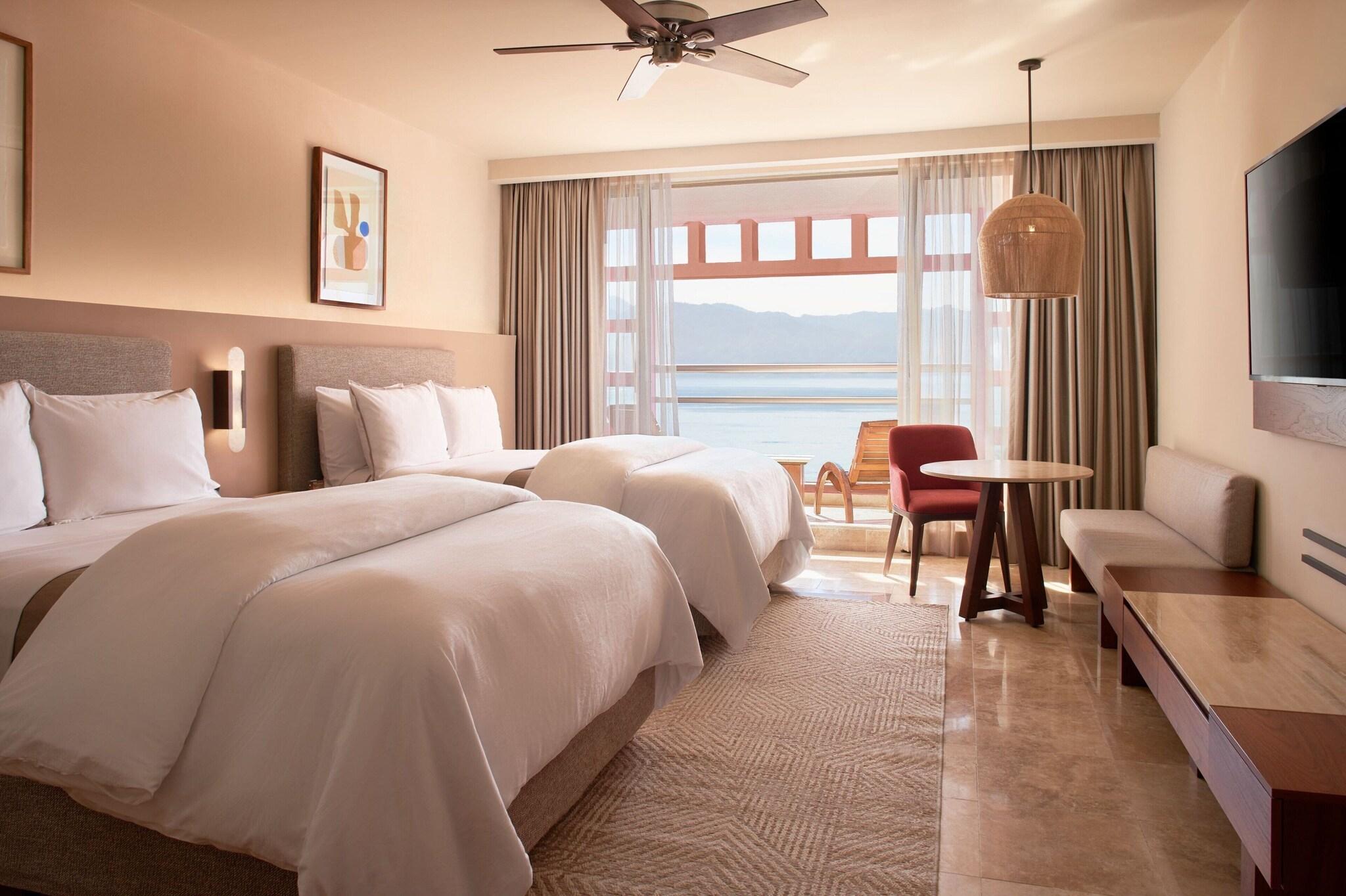 Junior Suite Partial Ocean View Two Double Beds