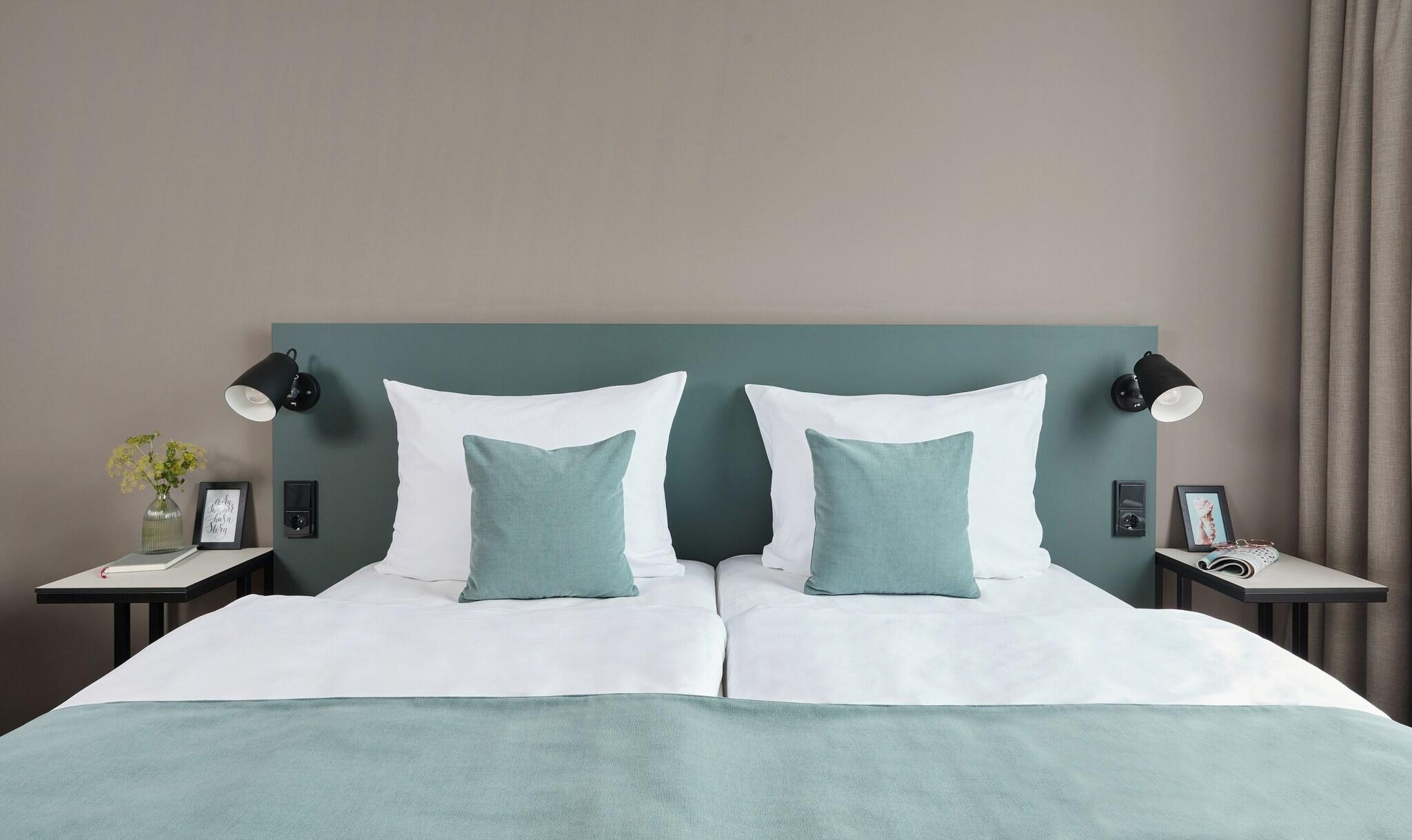 Twin Deluxe Queen Bed