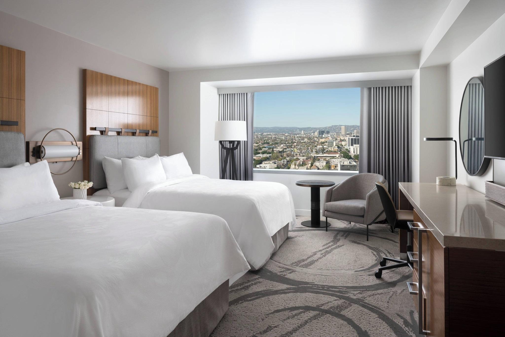 Quadruple City View Two Queen Beds