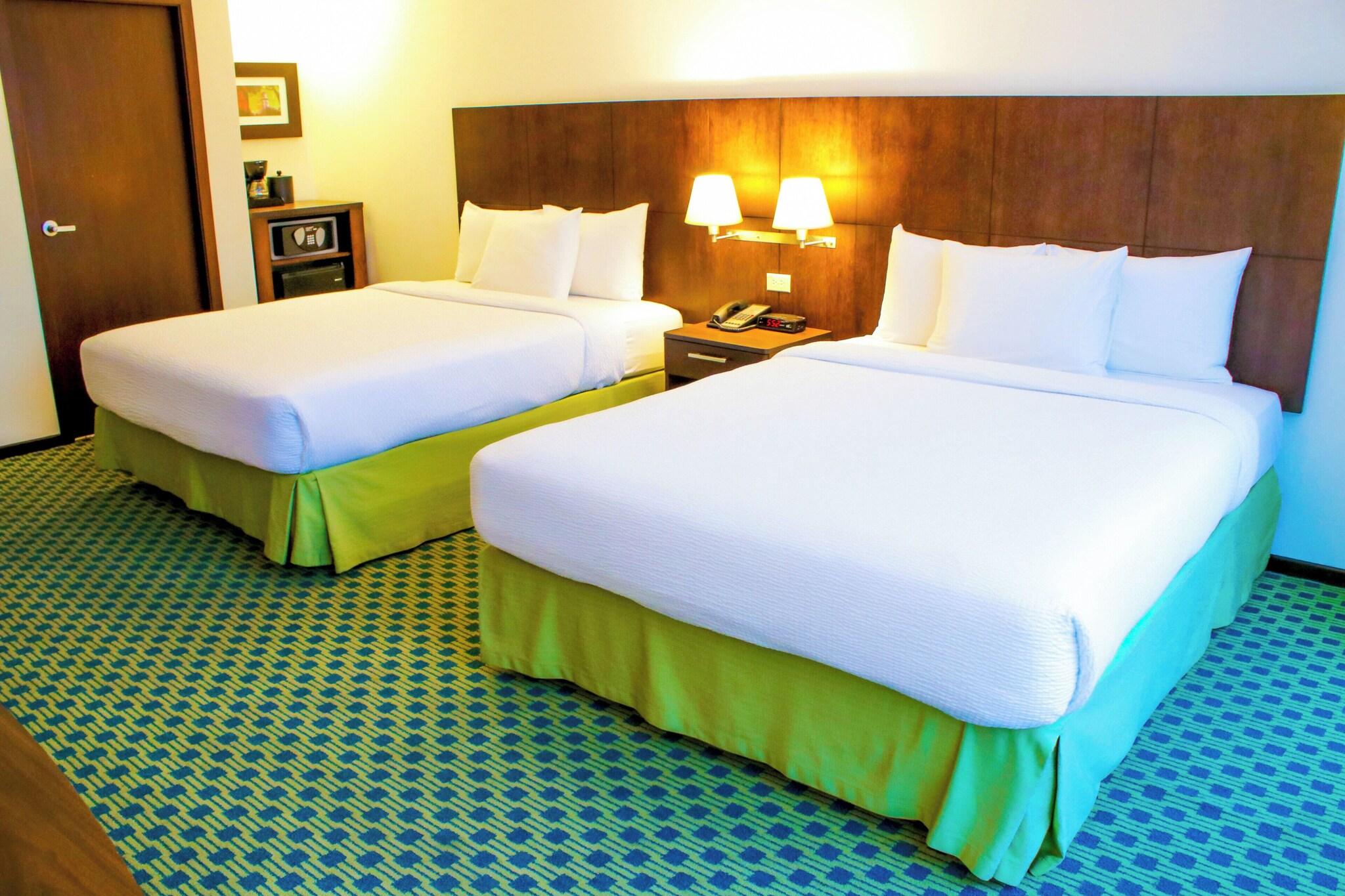 Quadruple City View Two Queen Beds