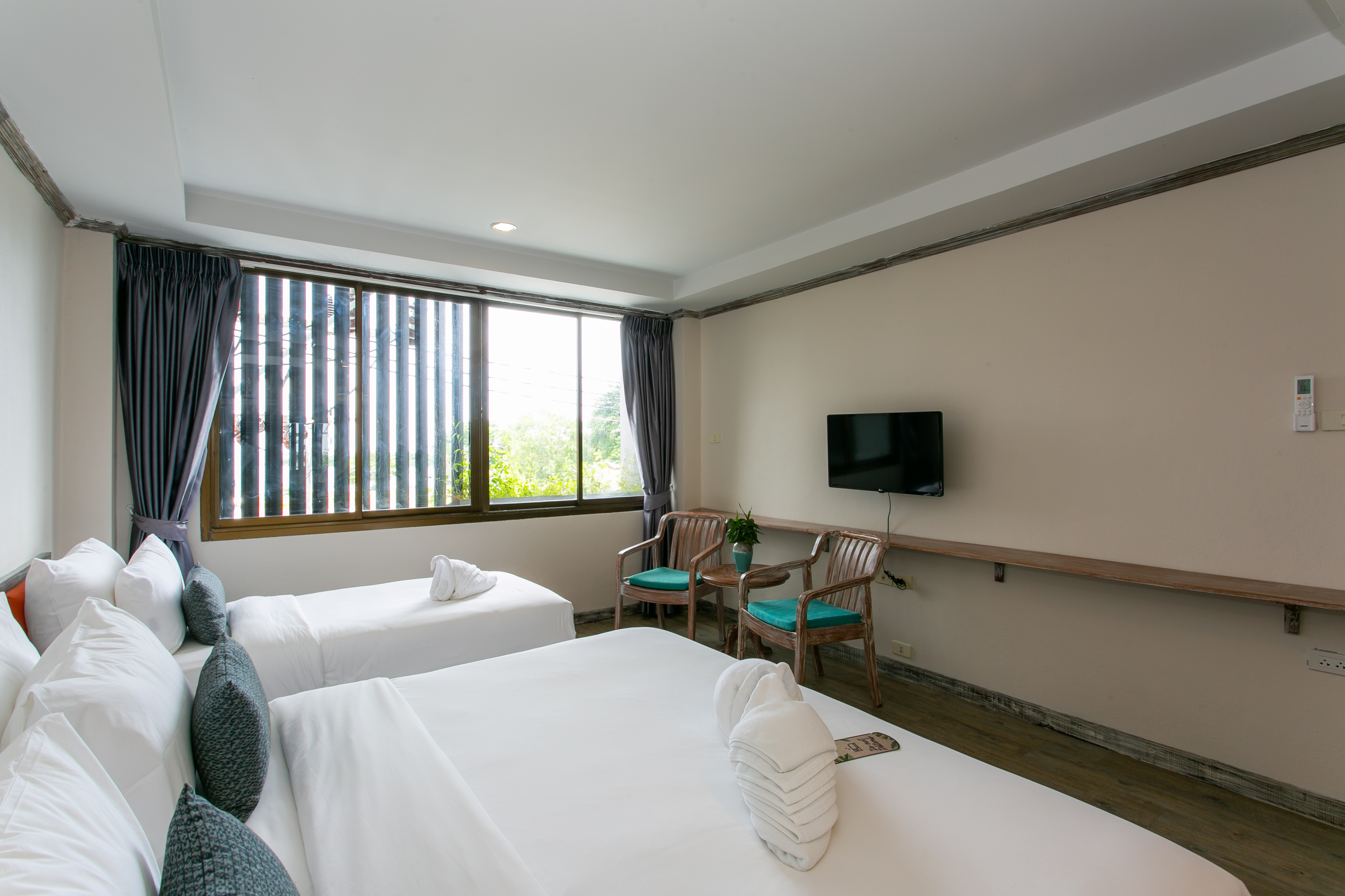 Triple Deluxe Queen Bed