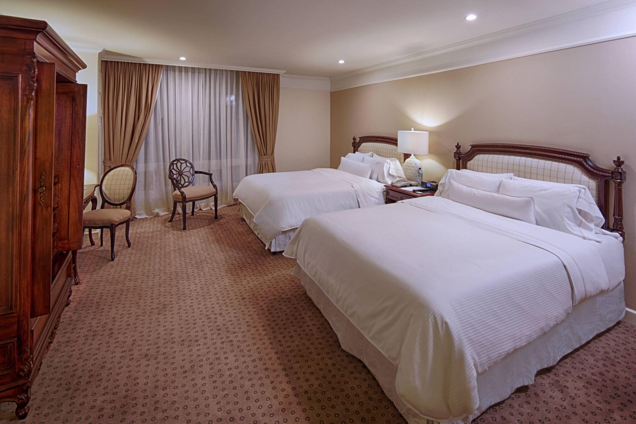 Quadruple Deluxe Two Queen Beds