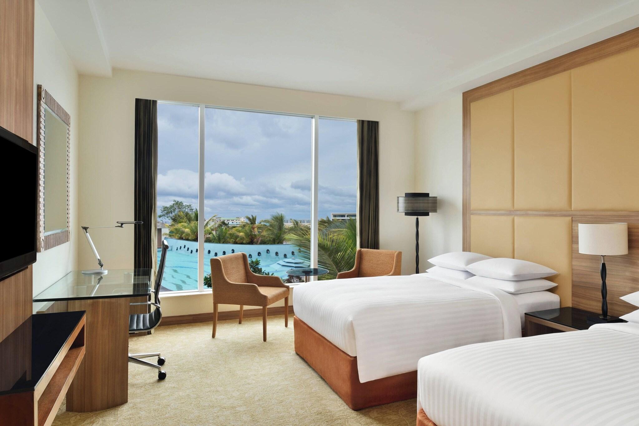 Quadruple Pool View Two Double Beds